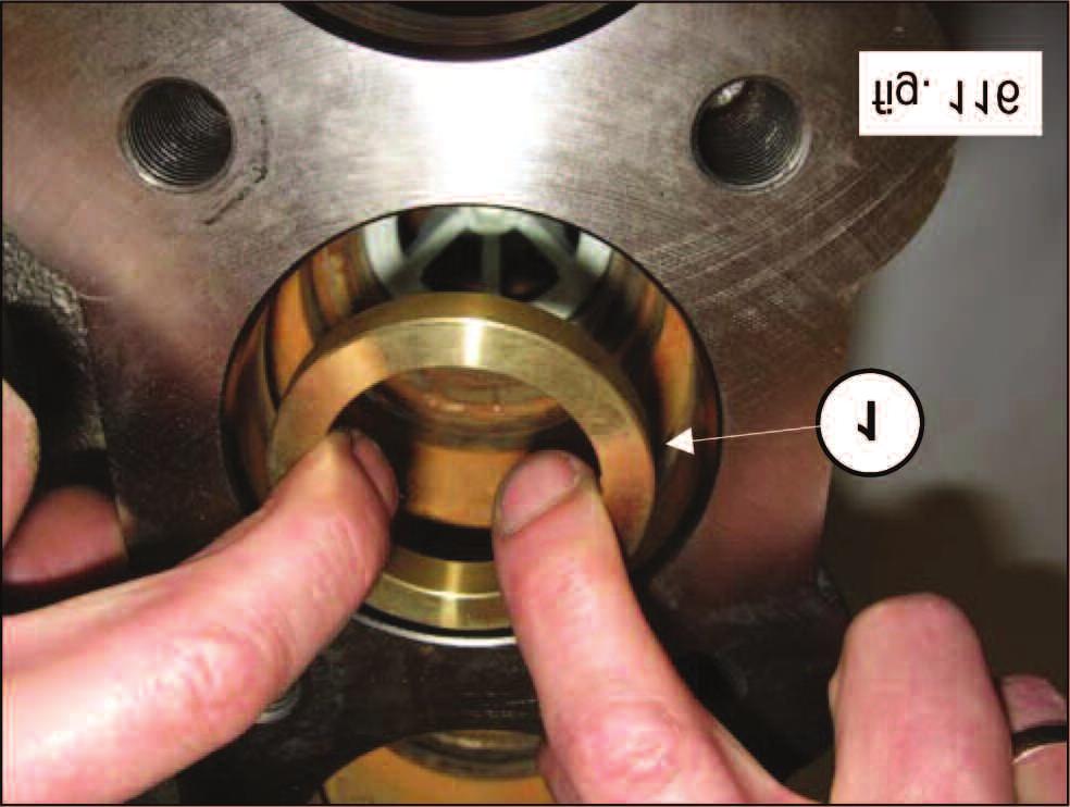 115. Insert the valve housing spacer ring (1, fig.