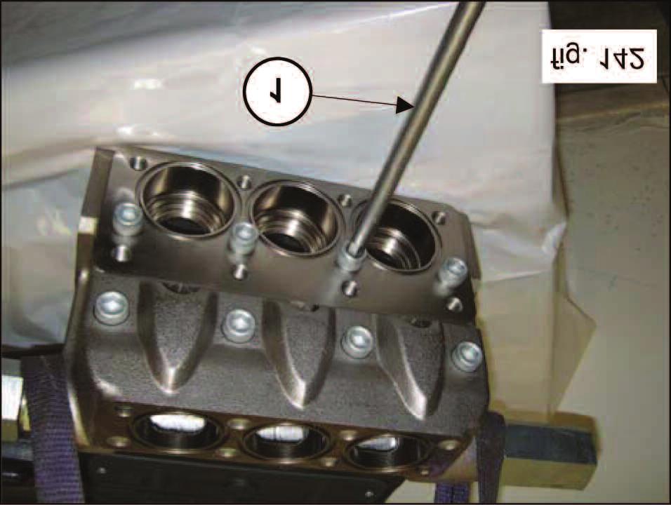 the inner guide and remove the valve guide from the valve housing. (1, fig. 141).
