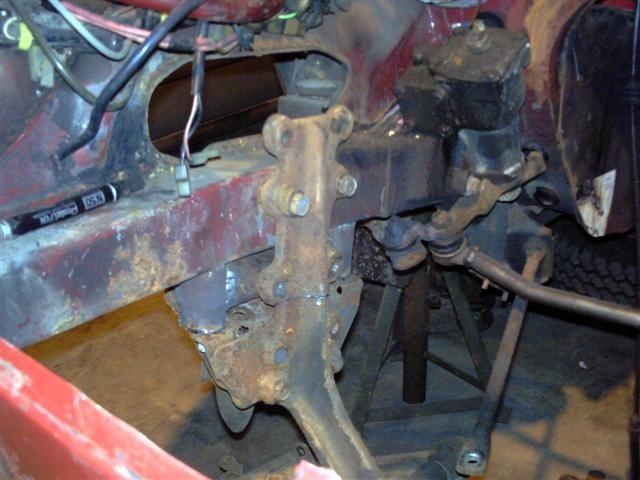As you can see, the bolt holes for the top wishbone are in the standard location, as are those for the engine mounts. Nice eh Get a good weld in there to hold it all together.