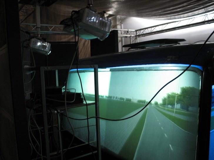 Fig. 4. The test simulator with "on screen" projection - visible cabin with "on screen" screens on the windscreen and windscreen supports projectors. 3.
