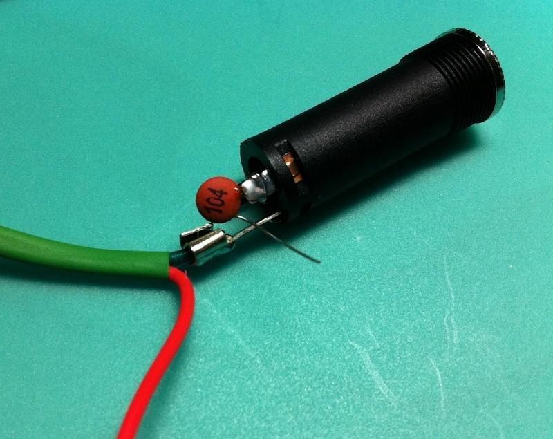 Solder the ground wire to the lug for the sleeve, as seen below.