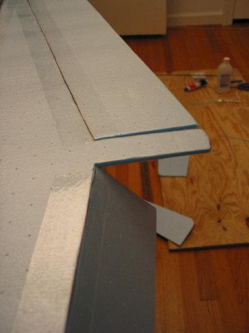 Place clear packing tape along the aileron with