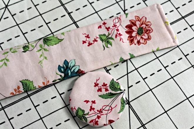 Step 5: The center of the flower is created by first taking the two 16 ½ pieces and centering one with the strip of 16 fusible fleece and bonding the fleece to the wrong side.