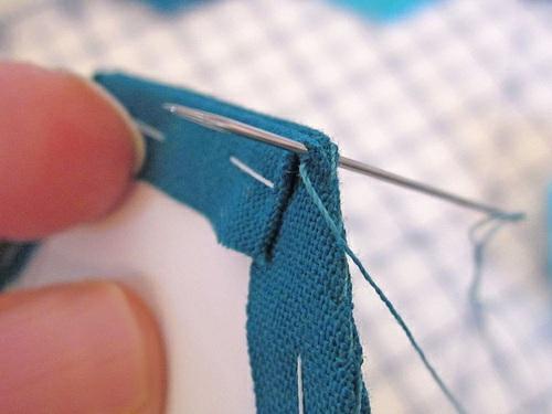 9. To join the hexagons, place two adjacent hexagons right sides together. Thread a hand sewing needle with matching thread and knot the end.