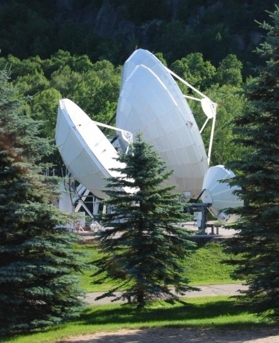 Uplinks From the two Processing Centers, the four sets of corrections are sent to six Land Earth Stations (LES) for uplink to six L-band communications satellites.