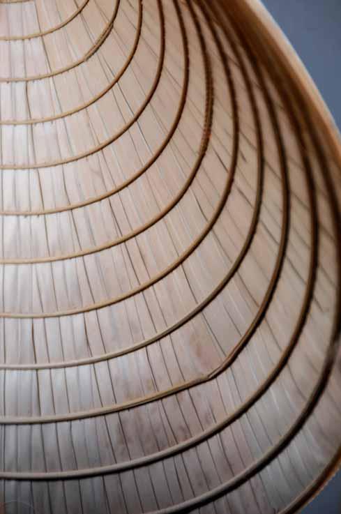 I was attracted by the lines. This was the inside of the traditional conical hat of the Vietnamese, shot at an angle. Some cropping was done to remove the unwanted areas.