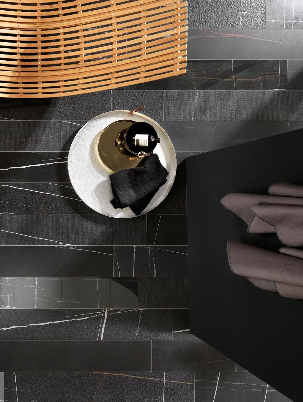 ITA257 Sahara Noir Listello Mix The combination of surfaces creates tactile patterns which enhance porcelain stoneware s status as a refined, contemporary material.