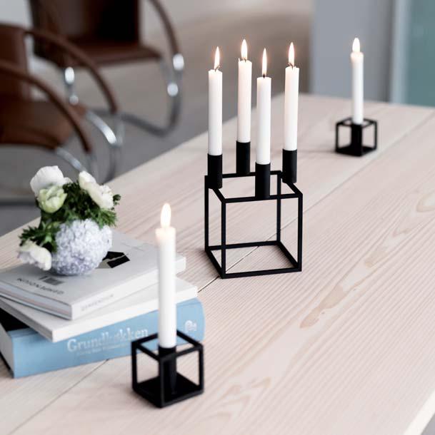 The result was the iconic squareshaped lacquered steel frame topped with candleholders, a design today prized and admired the world over for its