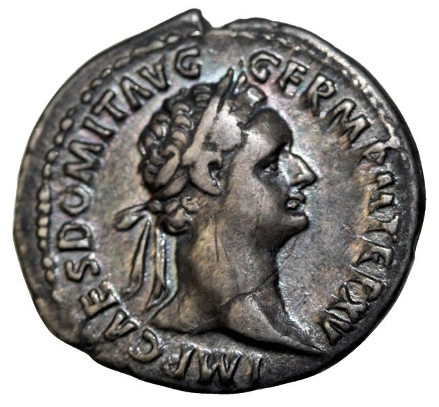 The portrait on the obverse (or front) of the coin, along with the legend, tell us that the coin was struck in the reign of Domitian.