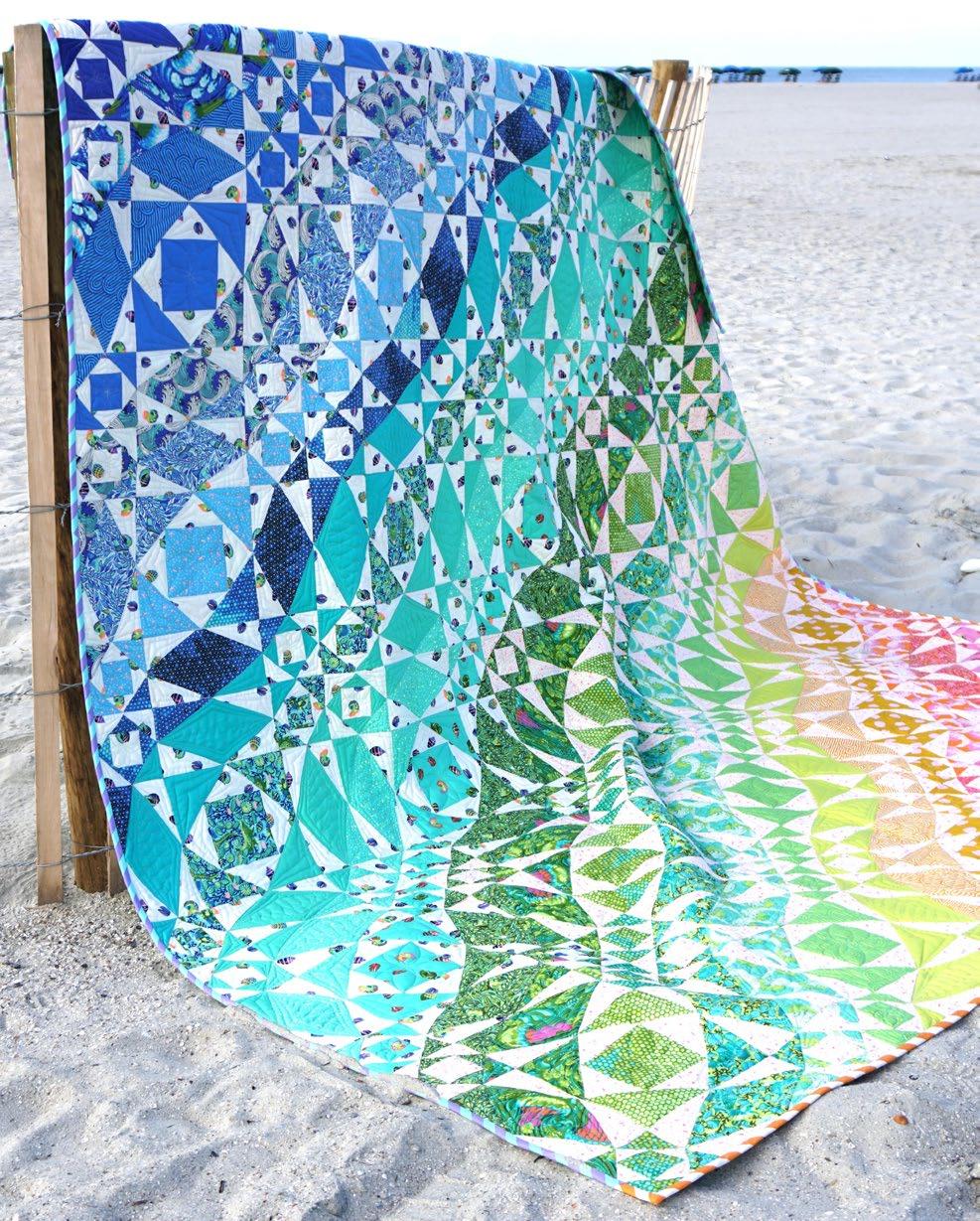 Featuring Zuma by Tula Pink This beautiful quilt is both paper pieced and traditionally pieced to create these beautiful waves of color motion.