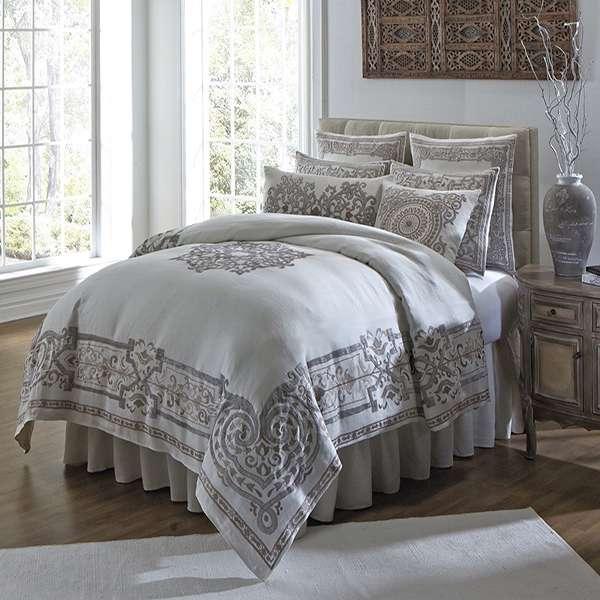 VERNAZZA The Vernazza Bedding Collection An exquisitely handcrafted bedding ensemble made with our finest linen, adorned with hand applied velvet scroll accents and embroidered