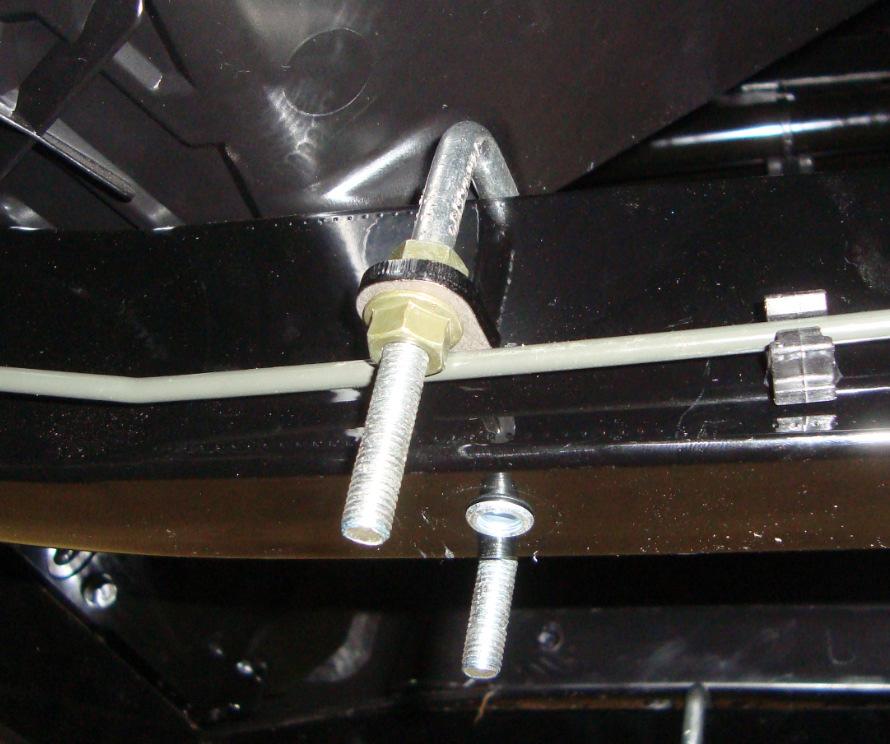 (See Illustration 2-2 and 2-3). 4. Position the right rear u-bolt around the frame and brakeline as shown. Thread the first serrated nut, item #6, onto the u-bolt.