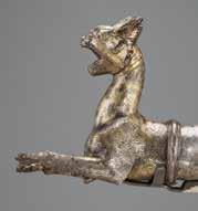 At the end of this rhyton is a fierce lynx ready to attack.