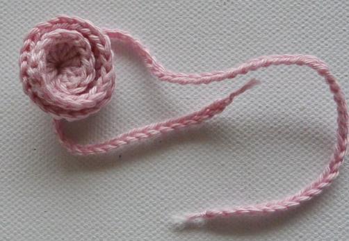 Use a yarn needle to fixate the curled