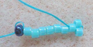 this one is easy - Pick up 1 Delica bead and pass with your needle through the