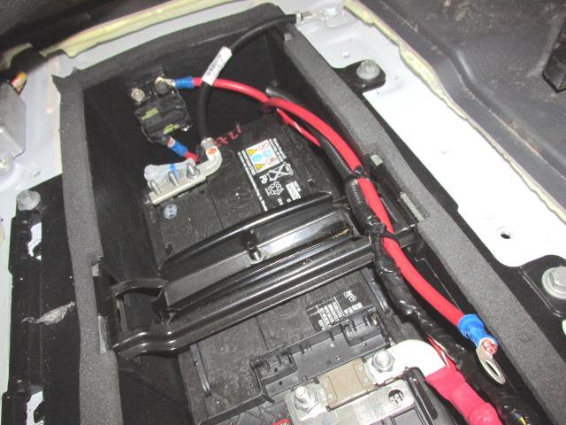 Remove battery access cover on the floor in front of the driver s
