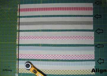 Place your ruler along the vertical line on your mat that is just over the edge of each strip set.