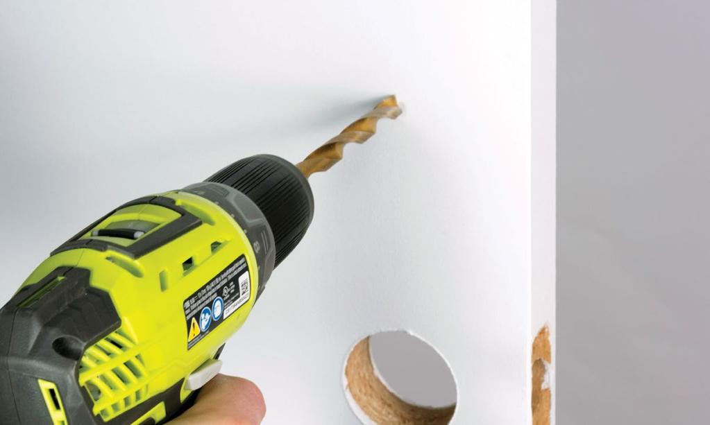 STEP 3 Drill holes. Exterior of Door Prepare your power drill with a ⅜ inch (10mm) drill bit. Align the drill bit over your mark and hold the door steady. Keep the drill level and straight.