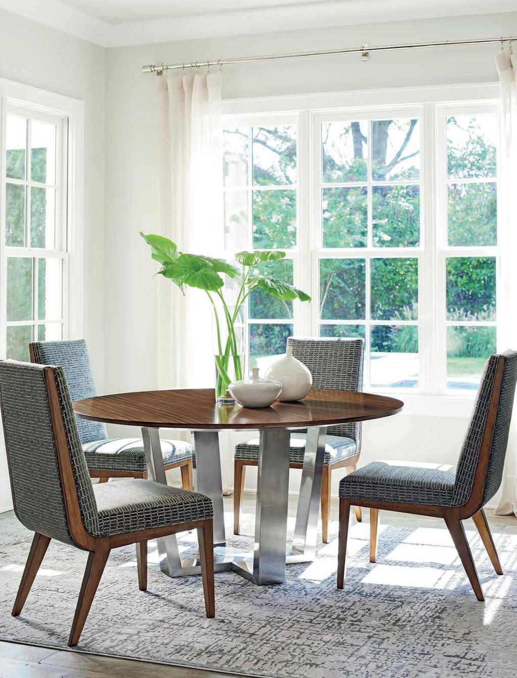 The 60-inch Mandara dining table is supported by a brushed stainless-steel base.