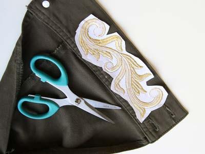 After embroidering, cut away the excess stabilizer from the back of the embroidery.