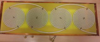 The simulation results of the spiral printed over FR4 (100Ω) are compared with the spiral placed in free space (188Ω) and a printed spiral excited with 116.6Ω generator. As it can be seen from Fig.