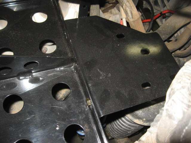 Step 11: Re-install the front section of the factory battery tray that you cut in step 9 using the front two