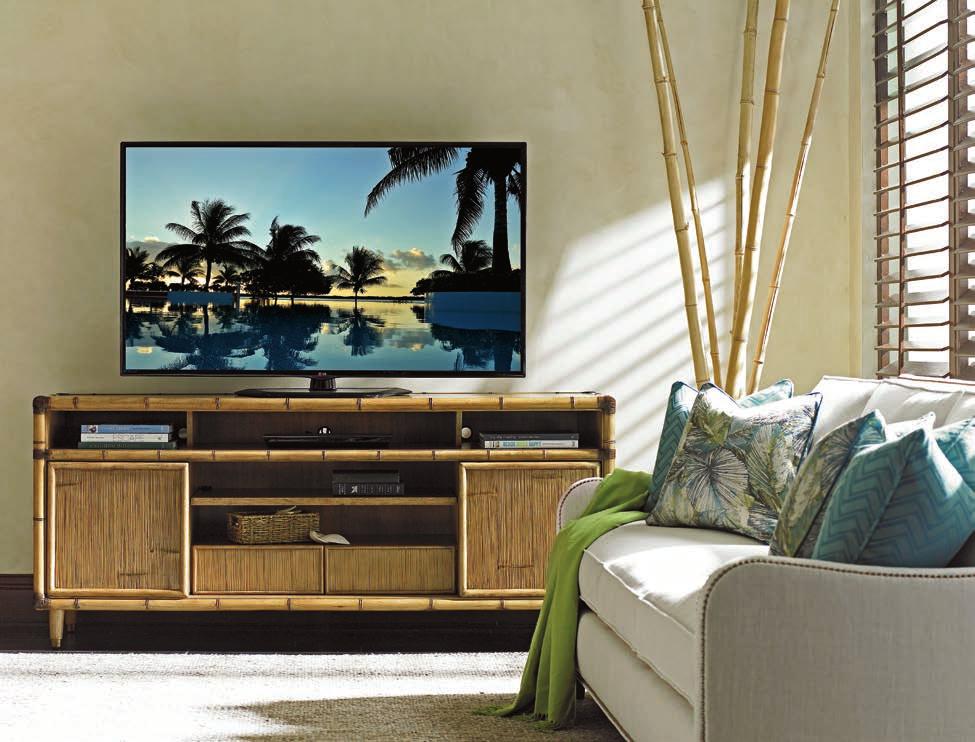 The 74- inch Sea Crest media console features four sliding doors across the front with decorative crushed bamboo panels.