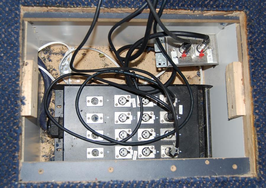 Microphone inputs for the desk are located near and in the platform at the front part of the church and in the old