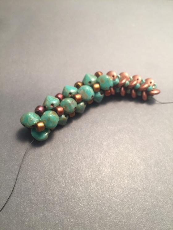 The next section uses the 2-hole Tipp beads in place of the 2-hole lentil beads, and 6/0 Matubo beads in place of the 8/0 turquoise beads.