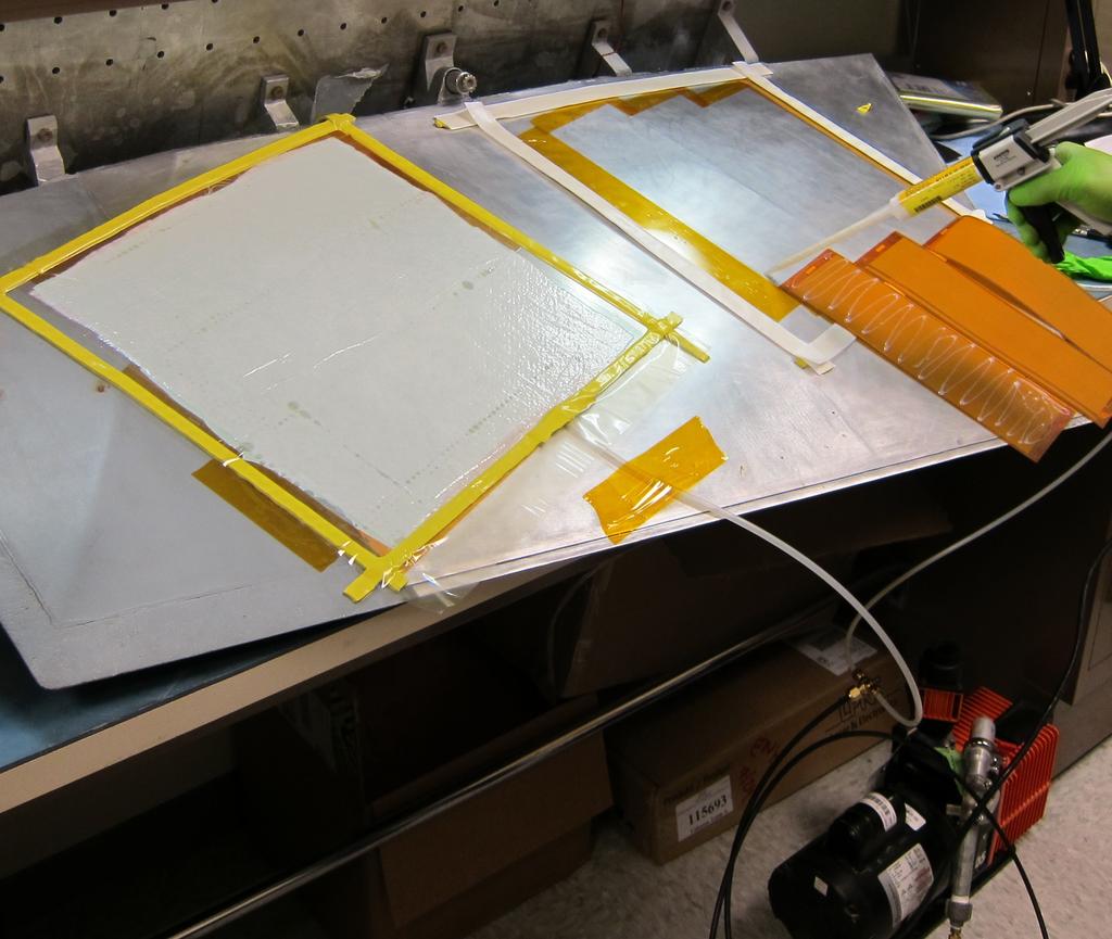 Figure 3.16: Vacuum Bagging Process laid around the patched area and a nylon bagging film was placed on top to cover the entire patched area. A 2.