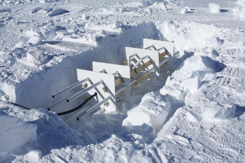 FIGURE 1. A fat tube-dipole deployed at the South Pole. Trenches are backfilled after deployment. FIGURE 2.
