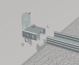 Grid component attached to a wall. Hold-down C-profile attached to a wall. Fit the grid wall connector to the main runner using self tapping screws.