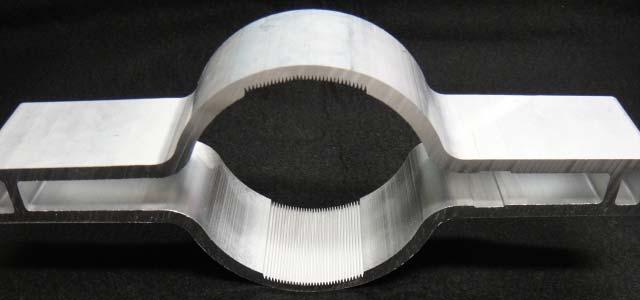 Grooved structure is formed by extrusion method. Beam pipe with groove structure can be bent.