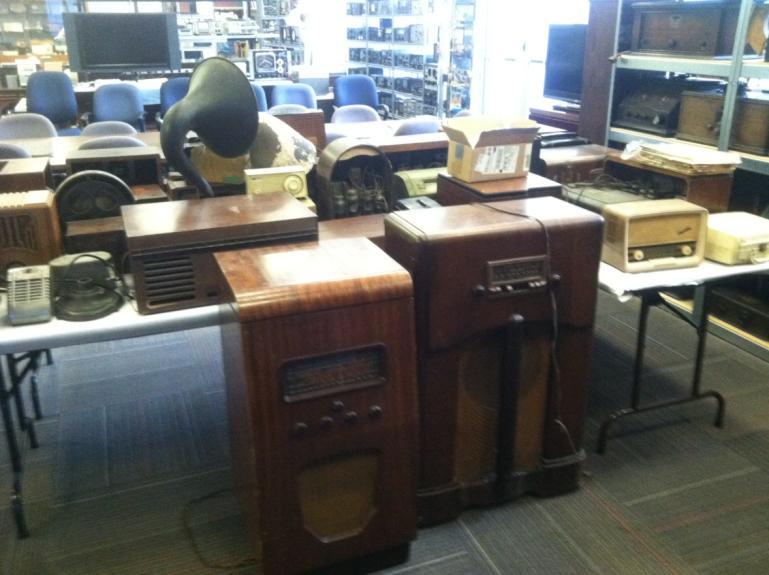 I have pictures of these radios set up in the main room of the Shop. Most of these radios are for sale to the general membership.