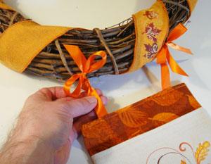 Tie a knot in each ribbon pair about 2 up from the top edge of the pouch.