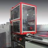 Robot load/unload with auto inverting offers six-sided machining capability on both bar and blank loading applications.