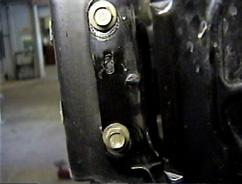 Align the baseplate with existing holes on the outside of passenger's side frame rail and tighten the two (2) existing bolts.