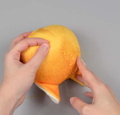 Once the plush is stuffed, make sure the seam allowances in the opening are tucked inside and prepare to ladder stitch