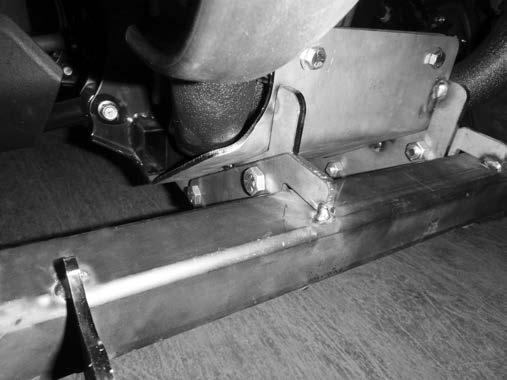 If the winch mounting holes do not align, insert 3/8" x 1 1/4" cap screws through the indicated holes in the winch plate and through the holes in the forward frame cross member and secure with 3/8"