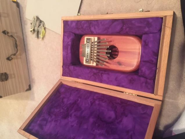 I also made a case for my smaller 8 note kalimba using a cigar box. I did not have to paint it.