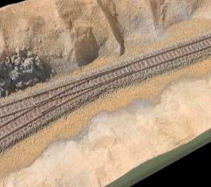 When the track is laid, the cess is a part of the track engineering that is completed before ballasting so ballast should be on top of it.