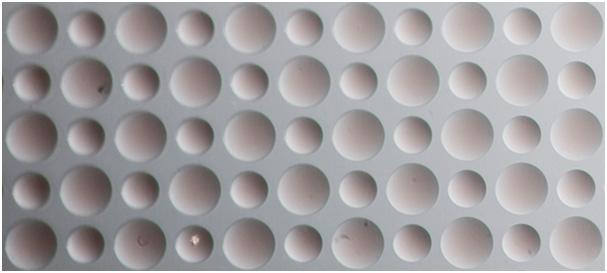 Figure 11: The array of microlenses used to cature the image in Figure 3. Notice the different focal lengths, which are couled with the microlens diameter for our microlens array.
