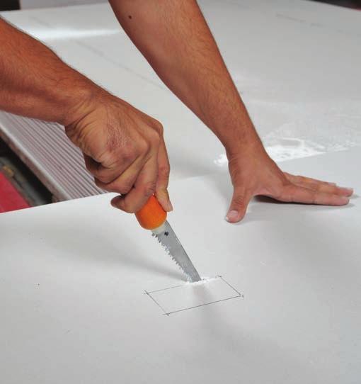 Tip: To get the saw started, drill holes at each of the corners but within the opening.