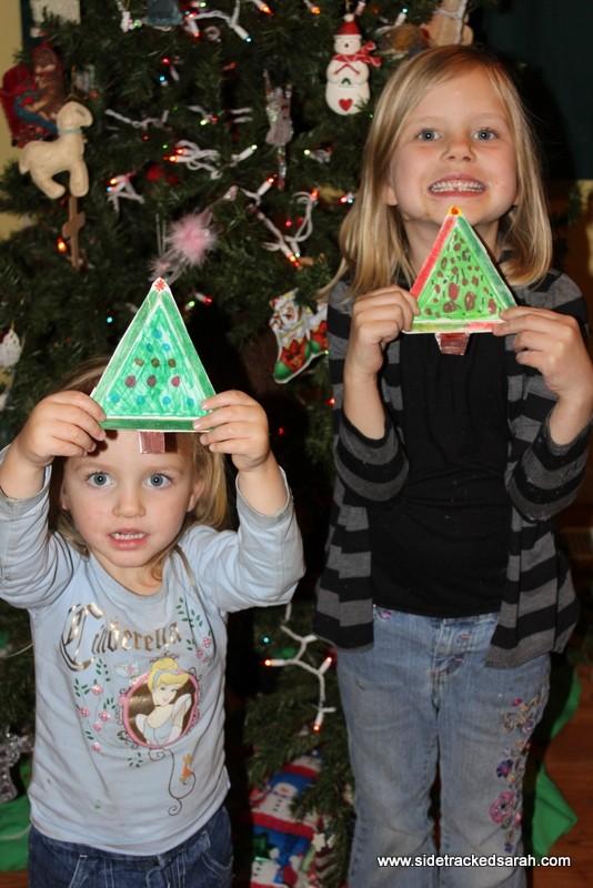 Color green and decorate like a Christmas tree with your markers. Cut a trunk out and glue that to the bottom.