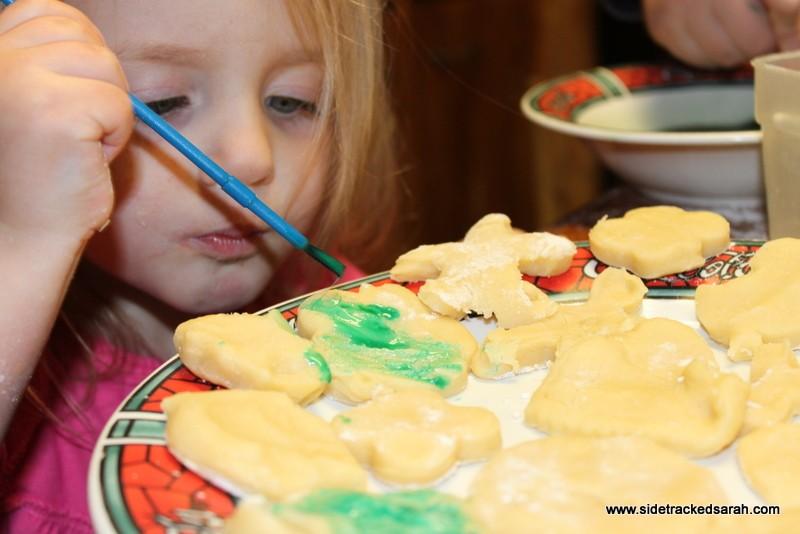Before you bake, paint each cookie with small paintbrushes dipped in the cookie paint.