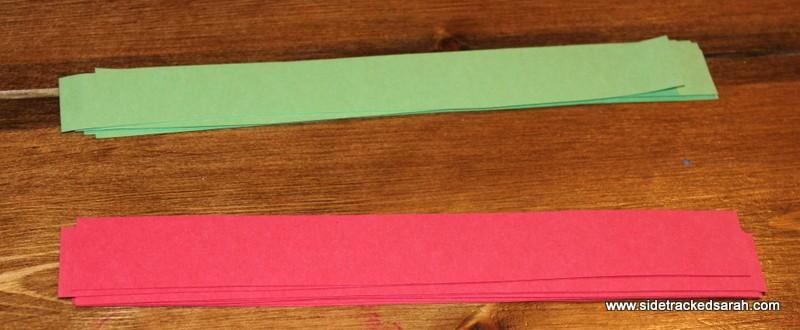 Directions: Cut several strips of red & green construction paper and loop them together with glue.