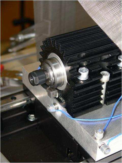 , 5b). a) b) Fig. 5. Micro-milling machine: a) workpiece and accelerometers attached to the workpiece, b) machine spindle and accelerometers attached to the spindle Cutting experiment was performed