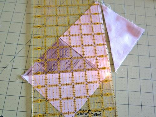 10. And as above, press the seam as sewn, then press the corner away from the block. 11. This completes the first flying geese block. 12.