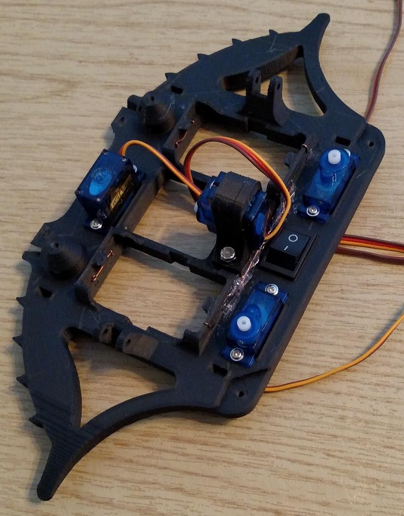 Add the servo motors, using the hardware supplied with them. I found on my second crab that all servos are not the same.