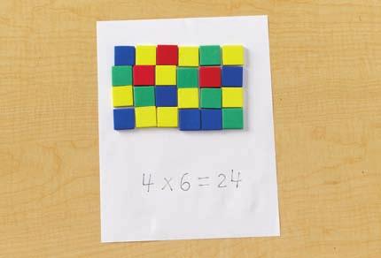 Remember that each pack has 6 cups. Students should begin to make rows of 6 tiles. 2.